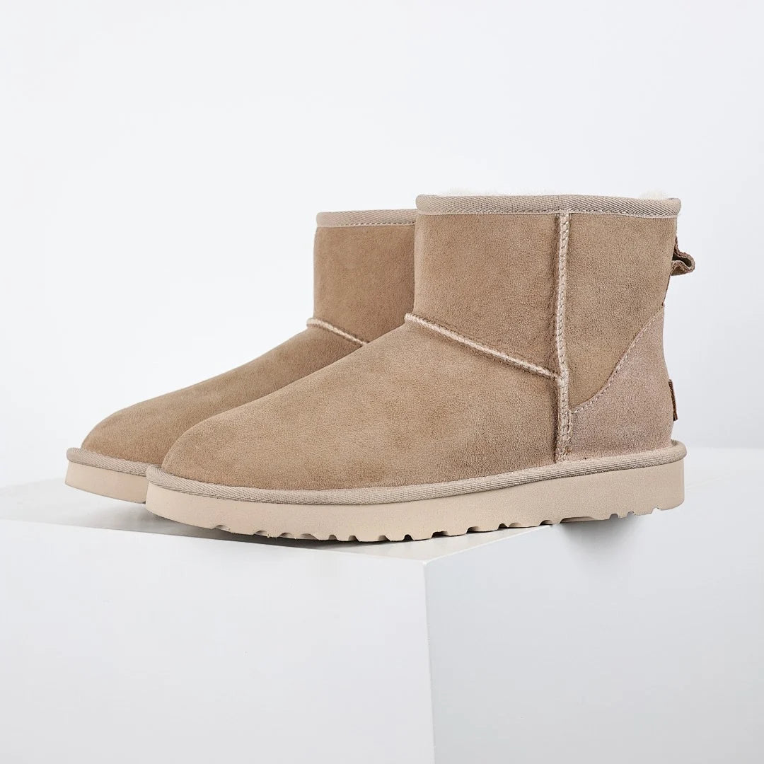 UGG Classic Mini Boot – Sand | Shearling-Lined Unisex Ankle Boot